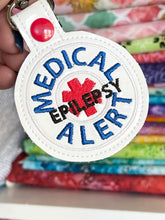 Diseño de bordado de pestaña a presión de epilepsia de alerta médica
