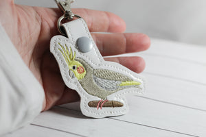 Onglet Snap Cockatiel dans le motif de broderie Hoop