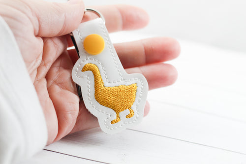 Motif de broderie à onglet pression Tiny Duck