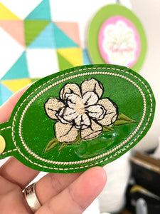 Filled Magnolia snap tab embroidery design
