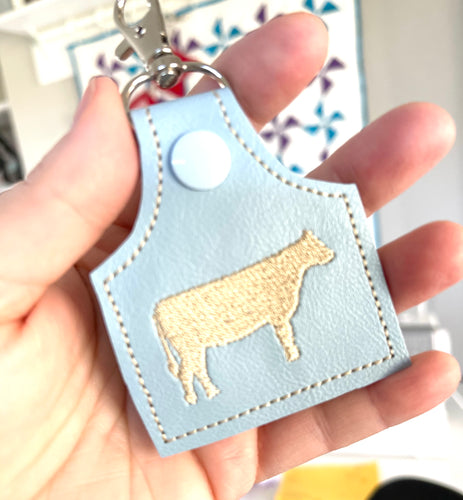 Cow tag shape with MINI COW snap tab for 4x4 hoops