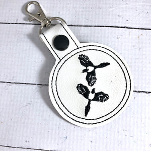 Two Magpies snap tab In the Hoop embroidery design